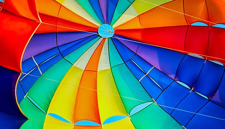 Canopy of a Multicolor Parachute in Air. SMR Group is Recruiting for a Safety Manager.