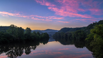 Scenic River Sunset. SMR Group is recruiting for a Director, Global Security.